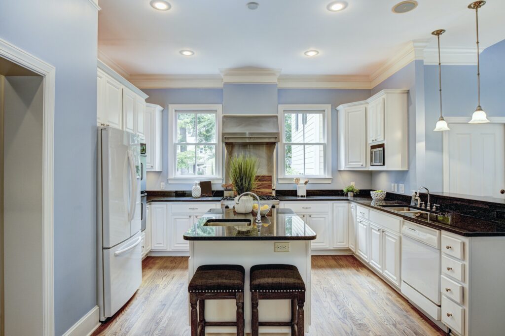 Large American style kitchen interior with granite countertops